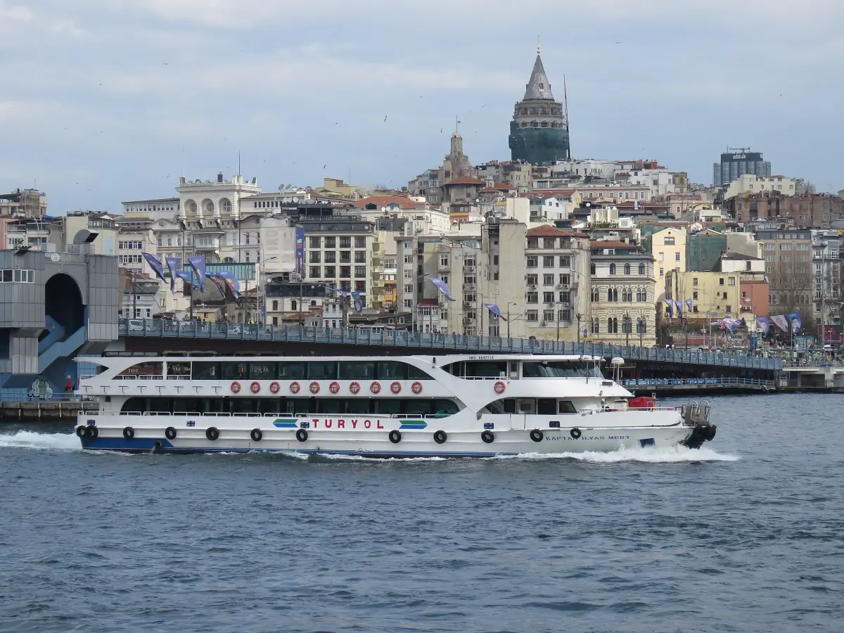A ferry in front of the Galata Bridge